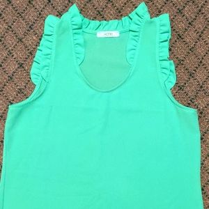 Light green sheer ruffle neck sleeveless blouse